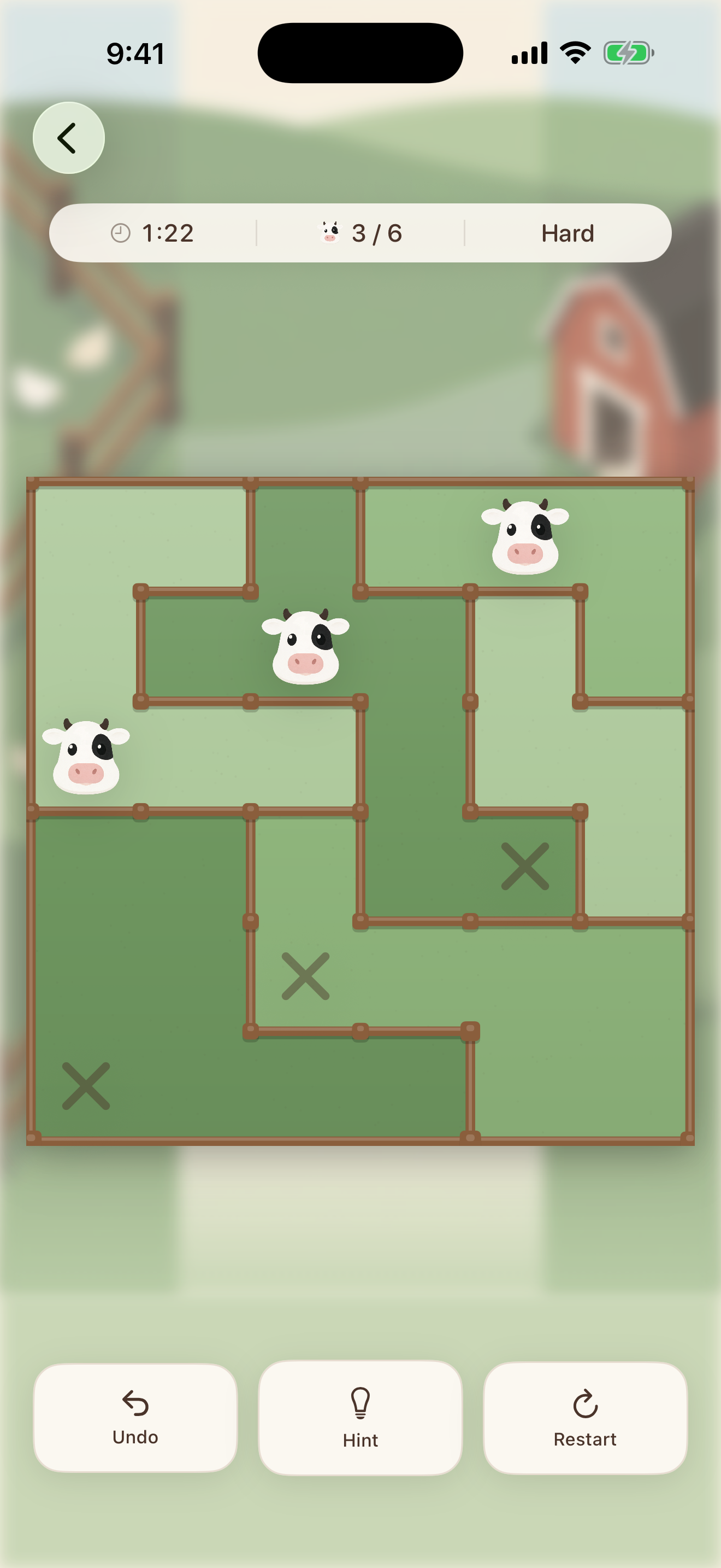 A Paddock board part-way through: a green field cut into paddocks by wooden fences, with three cows placed and three squares crossed out as ruled out.